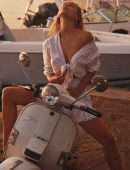 Alexis Ren Braless in a Sunset Photoshoot on a Scooter