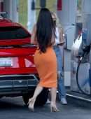 Kylie Jenner Booty in Tight Orange Dress at a Gas Station in Bel Air