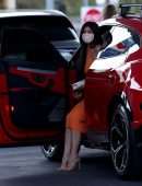 Kylie Jenner Booty in Tight Orange Dress at a Gas Station in Bel Air
