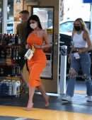 Kylie Jenner Booty in Tight Orange Dress at a Gas Station in Bel Air