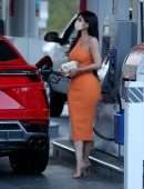 Kylie Jenner Booty in Tight Orange Dress at a Gas Station in Bel Air