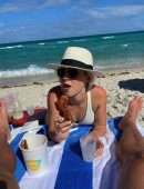 Claire Holt in One-piece Swimsuit as she takes a Dip in the Ocean in Miami