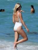 Claire Holt in One-piece Swimsuit as she takes a Dip in the Ocean in Miami