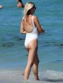 Claire Holt in One-piece Swimsuit as she takes a Dip in the Ocean in Miami
