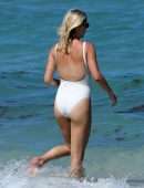 Claire Holt in One-piece Swimsuit as she takes a Dip in the Ocean in Miami