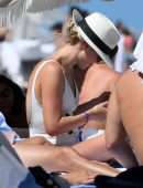 Claire Holt in One-piece Swimsuit as she takes a Dip in the Ocean in Miami
