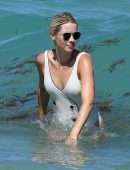 Claire Holt in One-piece Swimsuit as she takes a Dip in the Ocean in Miami