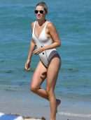 Claire Holt in One-piece Swimsuit as she takes a Dip in the Ocean in Miami
