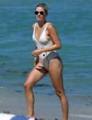 Claire Holt in One-piece Swimsuit as she takes a Dip in the Ocean in Miami