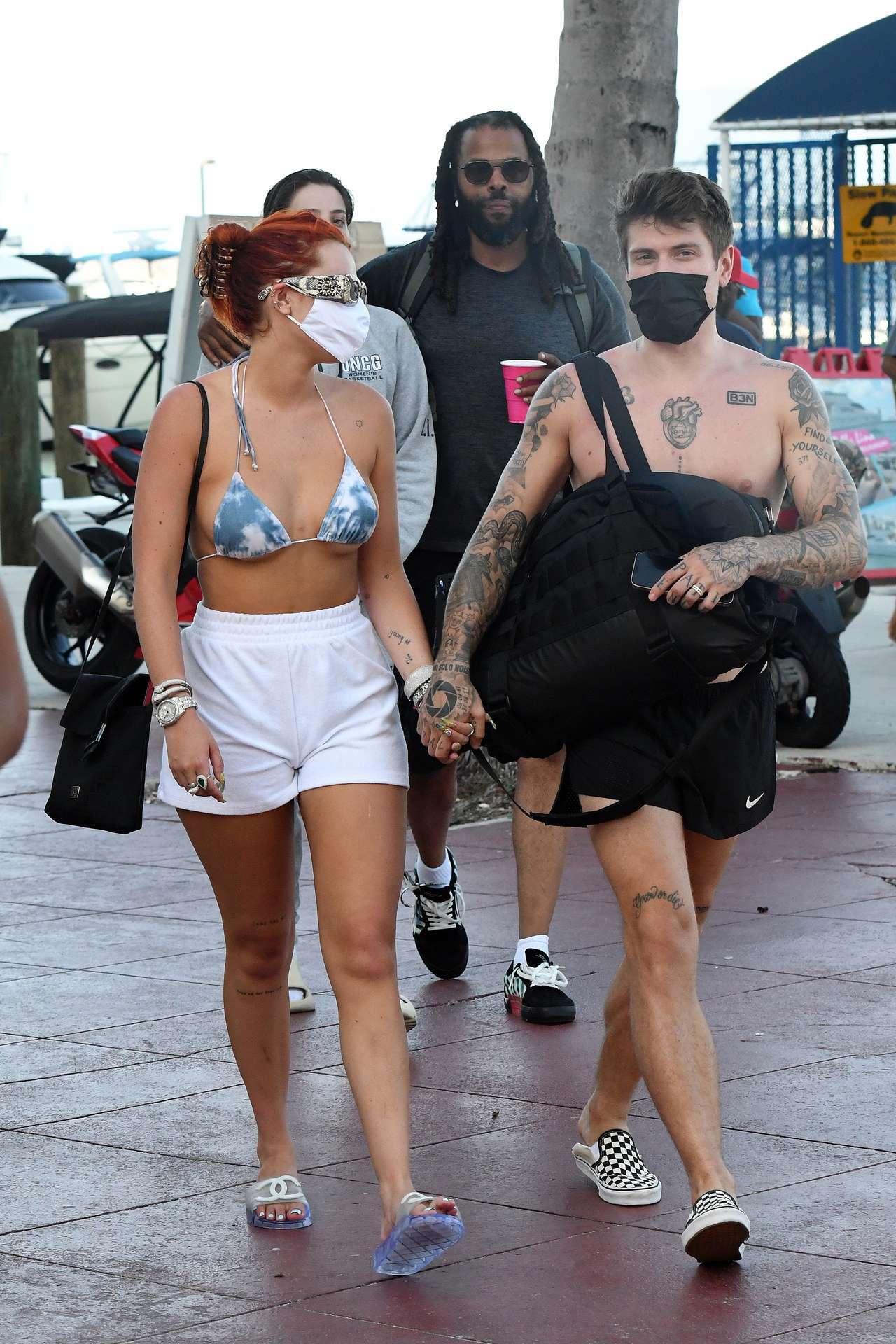 Bella Thorne in Bikini Top getting off a Yacht in Miami