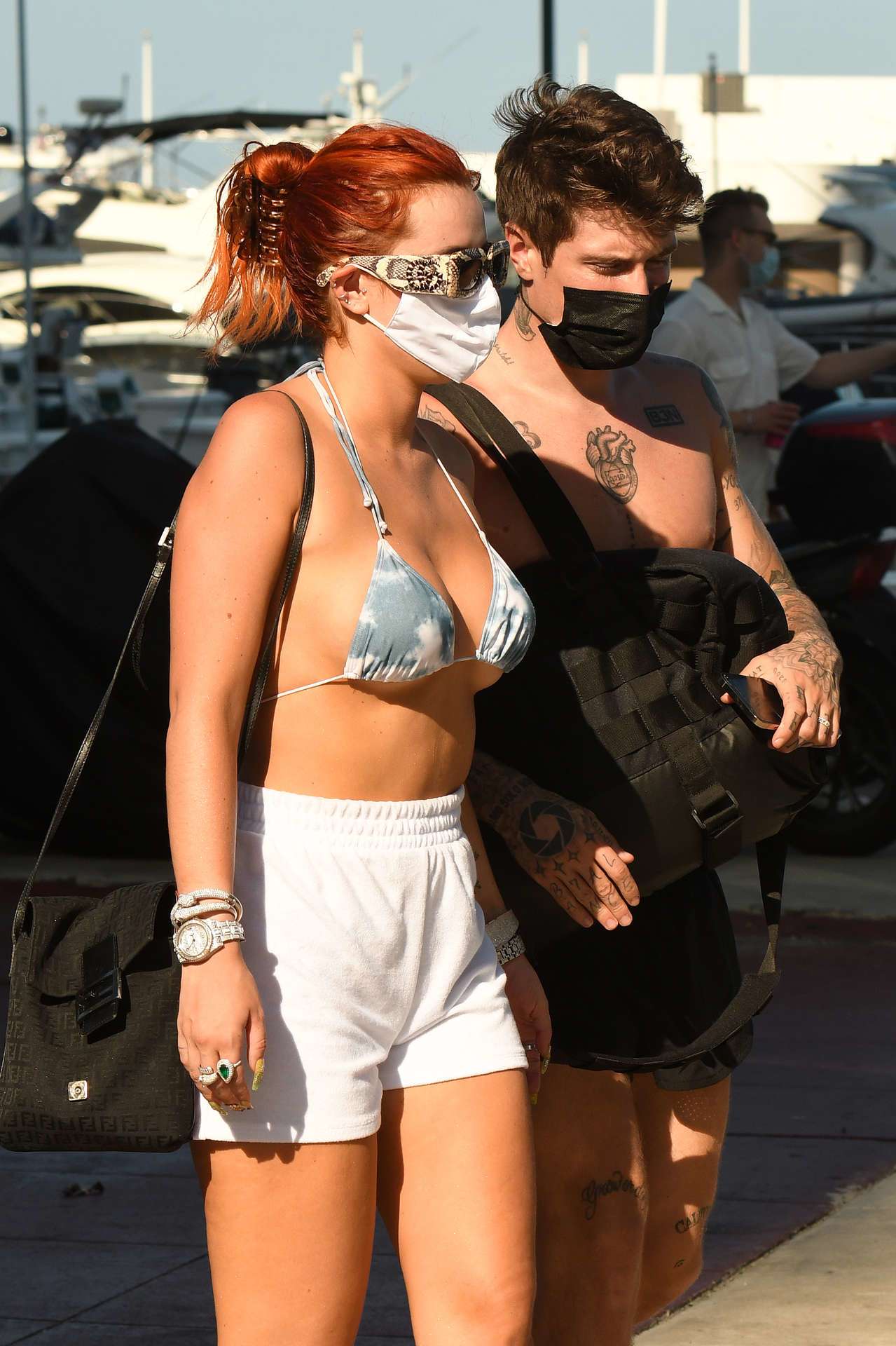Bella Thorne in Bikini Top getting off a Yacht in Miami