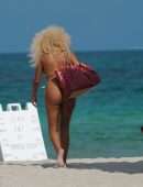 Afida Turner in a Tiny Yellow Swimsuit in Miami Beach, Florida
