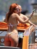 Bella Thorne Booty in Orange Bikini on Lake Como in Italy