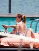 Bella Thorne Cleavage in Bikini Top in Lake Como