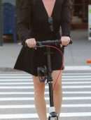 Jane Krakowski in Short Dress Riding a Scooter in NYC