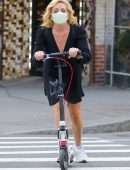 Jane Krakowski in Short Dress Riding a Scooter in NYC