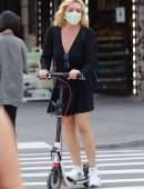 Jane Krakowski in Short Dress Riding a Scooter in NYC