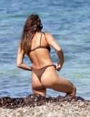 Irina Shayk Cleavage and Booty in a Thong Bikini on a Beach in Ibiza