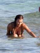 Irina Shayk Cleavage and Booty in a Thong Bikini on a Beach in Ibiza