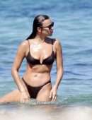 Irina Shayk Cleavage and Booty in a Thong Bikini on a Beach in Ibiza