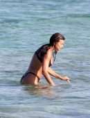 Irina Shayk Cleavage and Booty in a Thong Bikini on a Beach in Ibiza