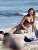 Irina Shayk Cleavage and Booty in a Thong Bikini on a Beach in Ibiza