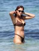 Irina Shayk Cleavage and Booty in a Thong Bikini on a Beach in Ibiza