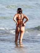 Irina Shayk Cleavage and Booty in a Thong Bikini on a Beach in Ibiza