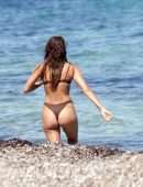 Irina Shayk Cleavage and Booty in a Thong Bikini on a Beach in Ibiza