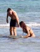 Irina Shayk Cleavage and Booty in a Thong Bikini on a Beach in Ibiza