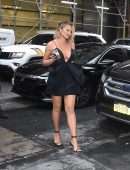 Chrissy Teigen Leggy in a Short Black Dress, Smiling' Out in New York