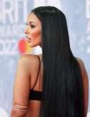Maya Jama Cleavage and Belly Button in Revealing Dress at The BRIT Awards 2022 in London