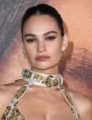 Lily James Cleavage in a Golden Dress at “Pam & Tommy” Finale Premiere in Los Angeles