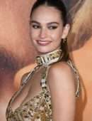 Lily James Cleavage in a Golden Dress at “Pam & Tommy” Finale Premiere in Los Angeles