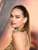 Lily James Cleavage in a Golden Dress at “Pam & Tommy” Finale Premiere in Los Angeles