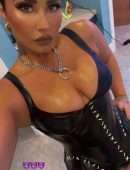 Demi Lovato Leggy and Cleavage in Leather Outfit