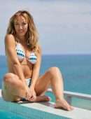 Moira Tumas in Bikini for Fitness Streaming Platform BeachSweat at Sir Ivan Wilzig’s Castle