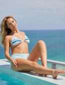 Moira Tumas in Bikini for Fitness Streaming Platform BeachSweat at Sir Ivan Wilzig’s Castle