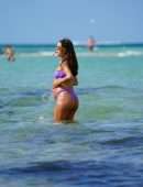 Camila Coelho Pregnant, Shows off at the Beach in a Purple Bikini in Miami