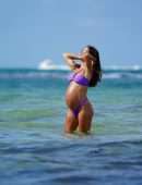 Camila Coelho Pregnant, Shows off at the Beach in a Purple Bikini in Miami