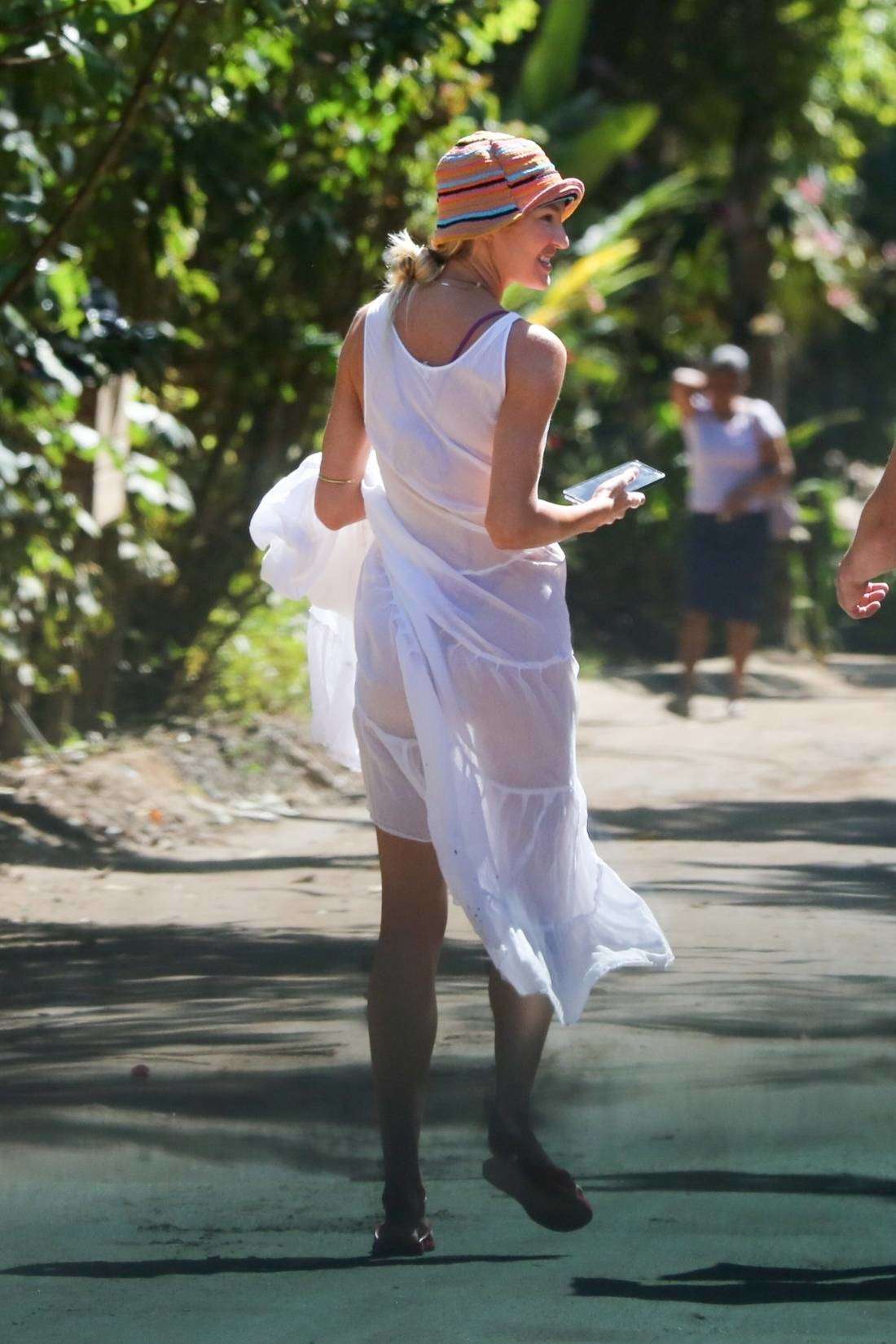 Candice Swanepoel in a White Dress, Seen on a Stroll Through the Trancoso Mainland