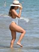 Eva Longoria Booty in a White Swimsuit on a Beach in Marbella
