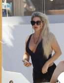 Bianca Gascoigne in a Black Swimsuit at Ibiza’s Cala de Bou Beach