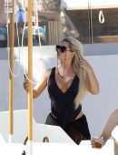 Bianca Gascoigne in a Black Swimsuit at Ibiza’s Cala de Bou Beach