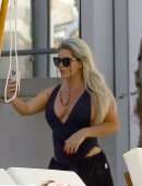 Bianca Gascoigne in a Black Swimsuit at Ibiza’s Cala de Bou Beach