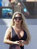 Bianca Gascoigne in a Black Swimsuit at Ibiza’s Cala de Bou Beach