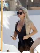 Bianca Gascoigne in a Black Swimsuit at Ibiza’s Cala de Bou Beach