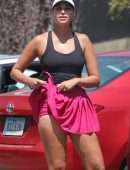 April Love Geary Leggy in Skirt Posing after Her Tennis Class in Malibu