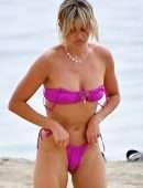 Ashley Roberts in a Pink Bikini on the Beach in Marbella