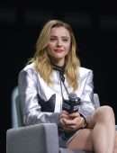 Chloe Moretz Leggy in Silver Jacket at CCXP 22 in Sao Paulo